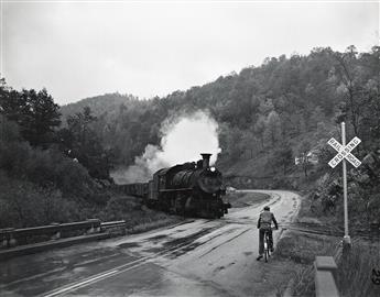 O. WINSTON LINK (1914-2001) A group of 5 photographs depicting scenes with Locomotives 104 and 563.